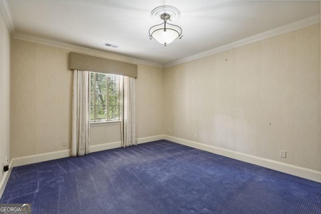 unfurnished room featuring dark colored carpet and ornamental molding