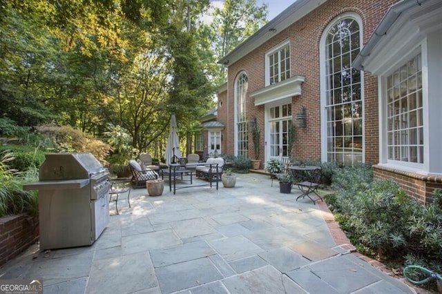 view of patio / terrace featuring a grill and an outdoor hangout area