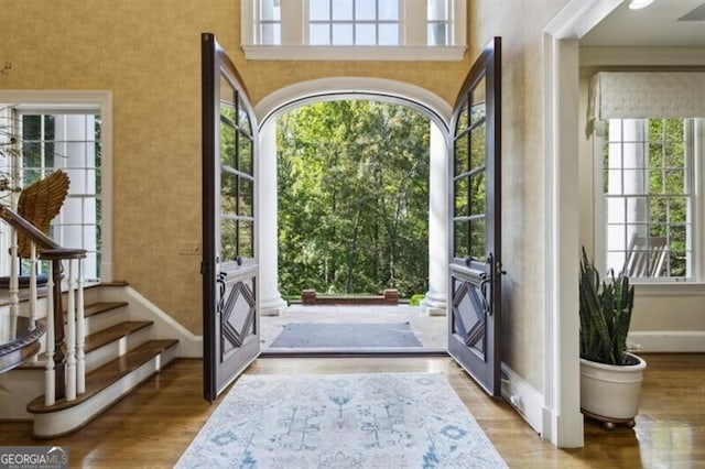 doorway featuring light hardwood / wood-style floors and a healthy amount of sunlight