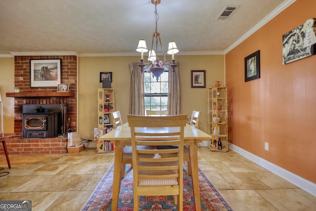 dining space with a textured ceiling, a wood stove, ornamental molding, and a notable chandelier