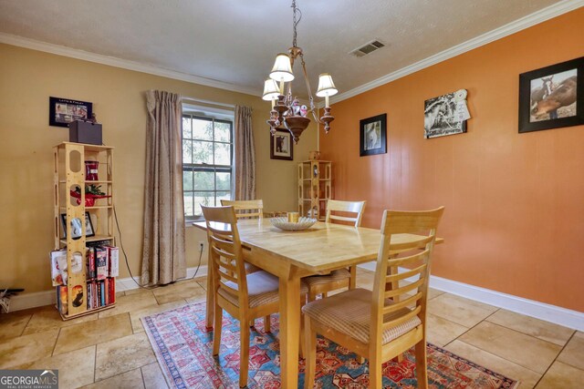 dining area featuring a textured ceiling, crown molding, and an inviting chandelier