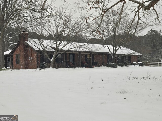 exterior space featuring brick siding