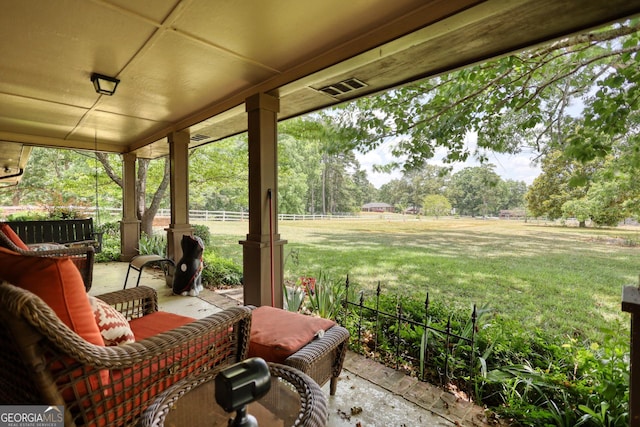 view of patio featuring fence