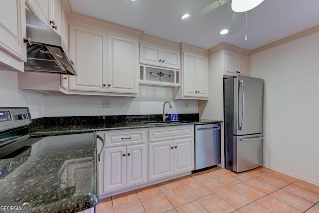 kitchen featuring sink, crown molding, light tile patterned floors, appliances with stainless steel finishes, and white cabinets