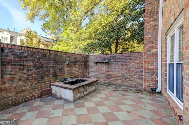 view of patio featuring a fire pit