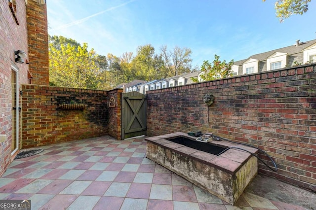 view of patio / terrace with an outdoor fire pit