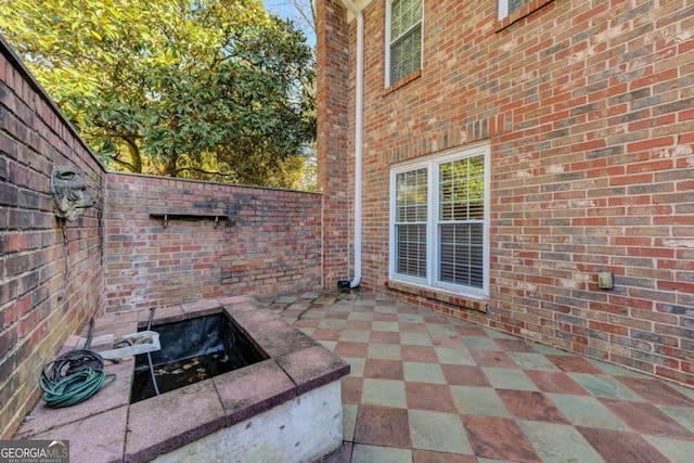 view of patio / terrace with a fire pit