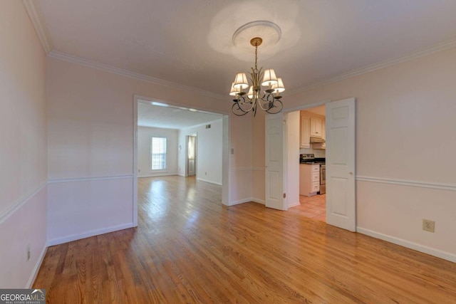 unfurnished dining area featuring ornamental molding, light wood-type flooring, and a notable chandelier