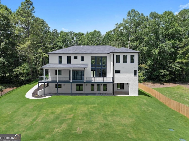 rear view of house with a lawn