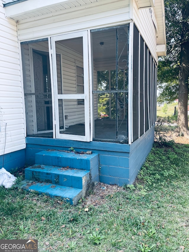 exterior space featuring a sunroom