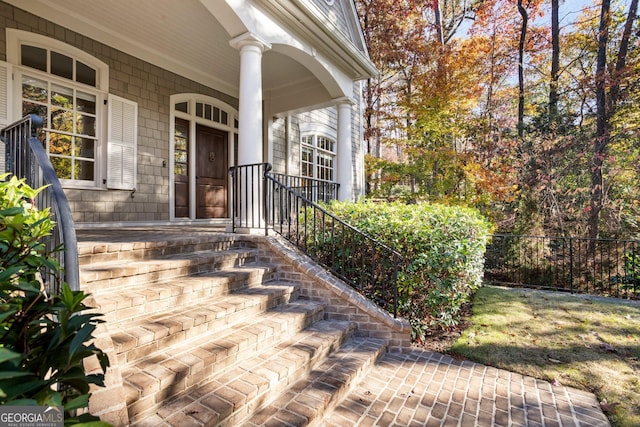 view of exterior entry featuring a porch