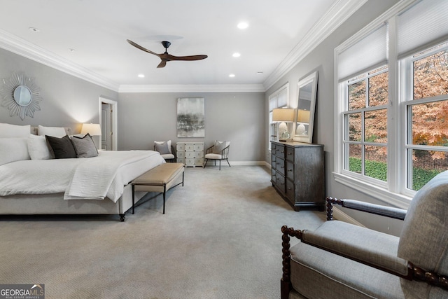 carpeted bedroom featuring ceiling fan and ornamental molding