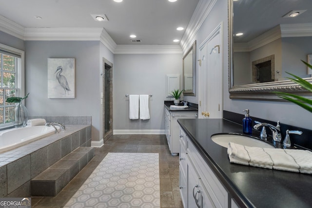 bathroom with plus walk in shower, vanity, and ornamental molding