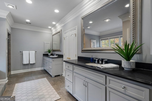 bathroom with vanity and crown molding