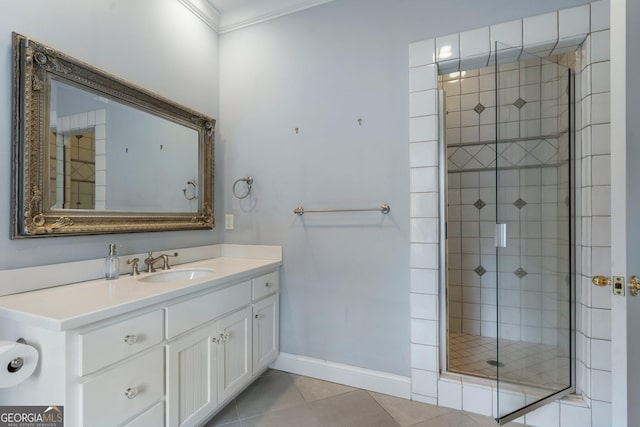 bathroom with vanity, tile patterned floors, an enclosed shower, and ornamental molding