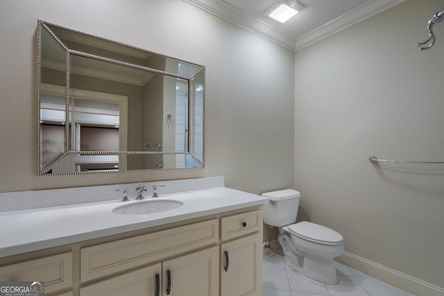 bathroom with toilet, vanity, tile patterned floors, and ornamental molding