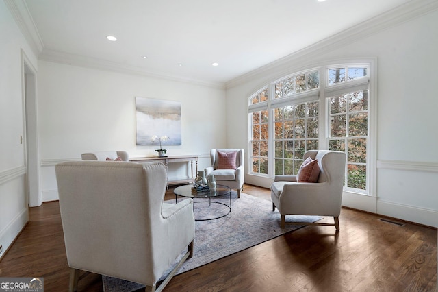 living room featuring dark hardwood / wood-style flooring and crown molding