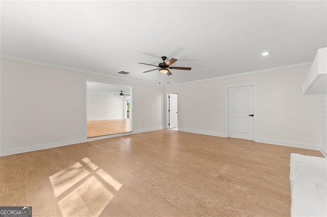 empty room featuring ceiling fan, light hardwood / wood-style flooring, and ornamental molding