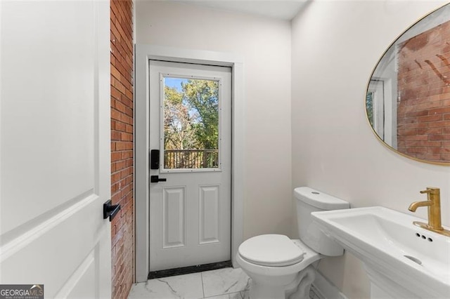 bathroom with toilet and sink