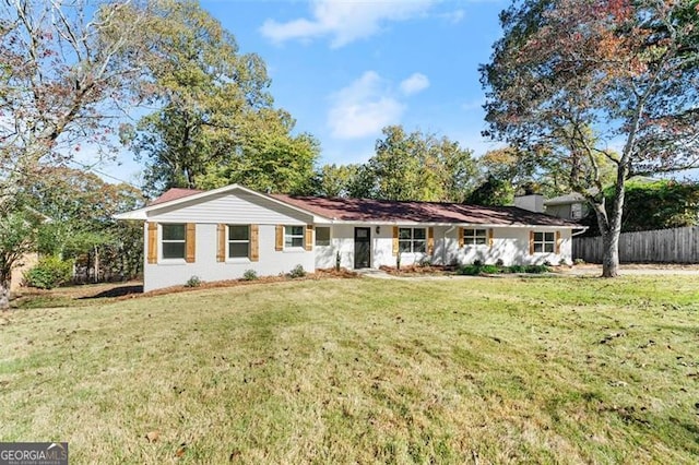 single story home with a front yard