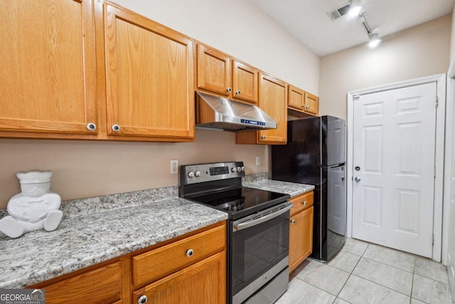 kitchen featuring black fridge, light tile patterned flooring, light stone countertops, rail lighting, and electric range