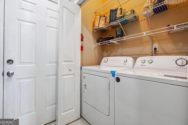 laundry room featuring washing machine and dryer