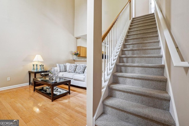 stairway featuring wood-type flooring