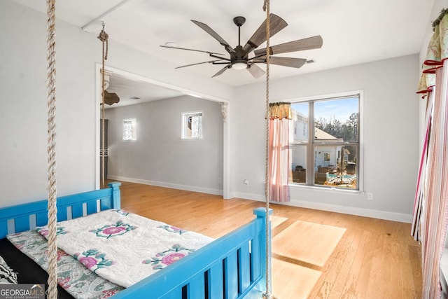 bedroom featuring ceiling fan and hardwood / wood-style flooring