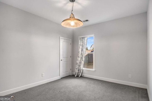 empty room featuring carpet floors