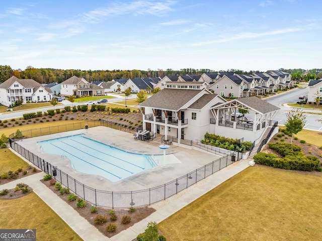 view of pool featuring a yard and a patio