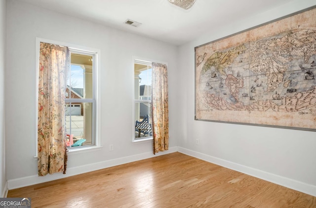 empty room featuring hardwood / wood-style flooring