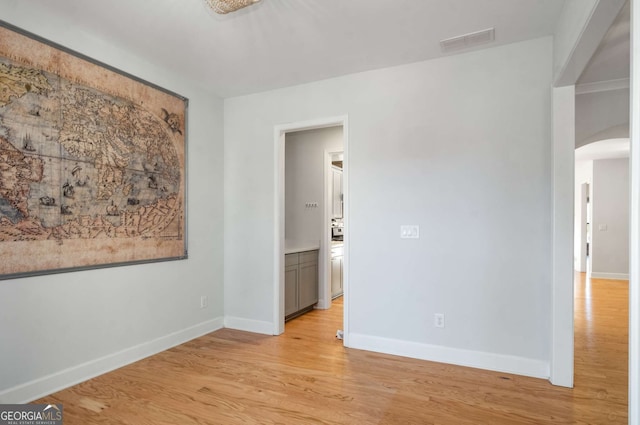 unfurnished room featuring light hardwood / wood-style flooring