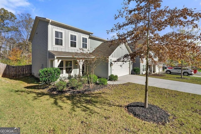 view of front facade with a garage and a front yard