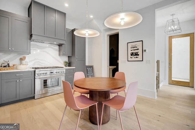 10871 Serenbe Ln, Chattahoochee Hills, GA 30268 - kitchen featuring high end stainless steel range oven, gray cabinets, light wood-style floors, recessed lighting, and a chandelier