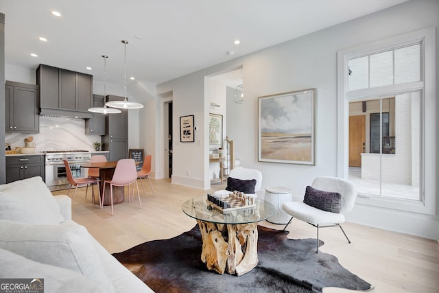 10871 Serenbe Ln, Chattahoochee Hills, GA 30268 - living area featuring light wood finished floors and recessed lighting