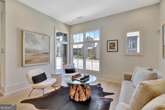 10871 Serenbe Ln, Chattahoochee Hills, GA 30268 - living area featuring wood finished floors and recessed lighting