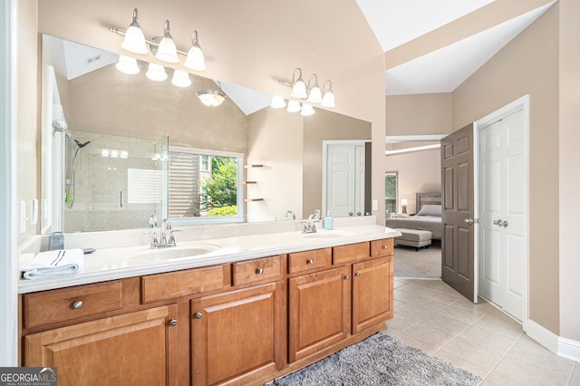 bathroom with vanity, tile patterned floors, and a shower with door