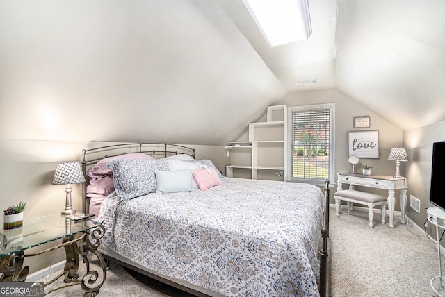 carpeted bedroom with lofted ceiling