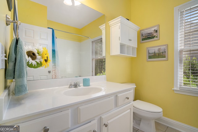 bathroom with vanity, a shower with shower curtain, tile patterned floors, and toilet