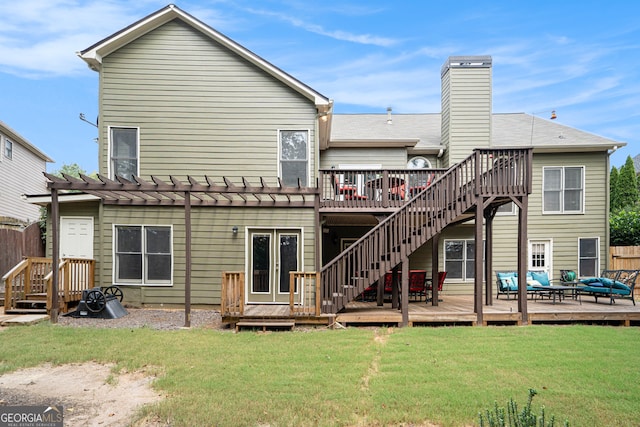 back of house with a pergola, a yard, and a wooden deck