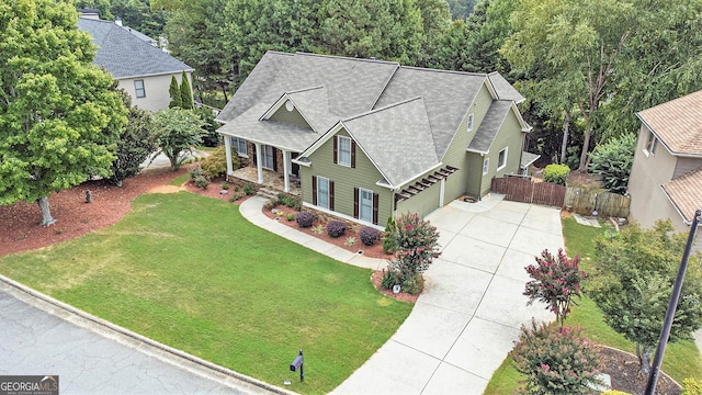 view of front of house featuring a front yard and a garage