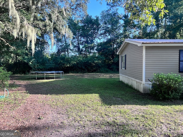 view of yard featuring a trampoline