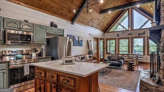 kitchen with wood ceiling, light hardwood / wood-style flooring, high vaulted ceiling, beam ceiling, and appliances with stainless steel finishes