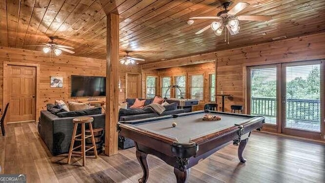 game room with wooden ceiling, ceiling fan, hardwood / wood-style floors, wooden walls, and billiards