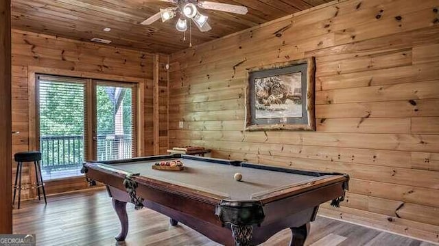 rec room featuring wooden ceiling, wood-type flooring, wooden walls, and pool table