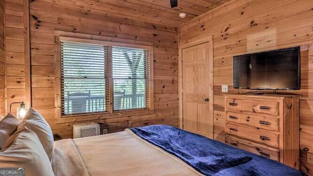 bedroom featuring wood walls and wood ceiling