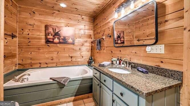 bathroom with tile patterned floors, wood ceiling, wooden walls, vanity, and a bath