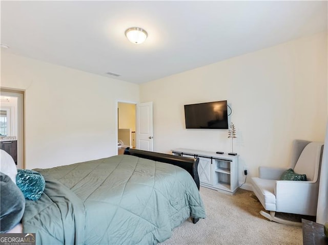 bedroom featuring light carpet and visible vents