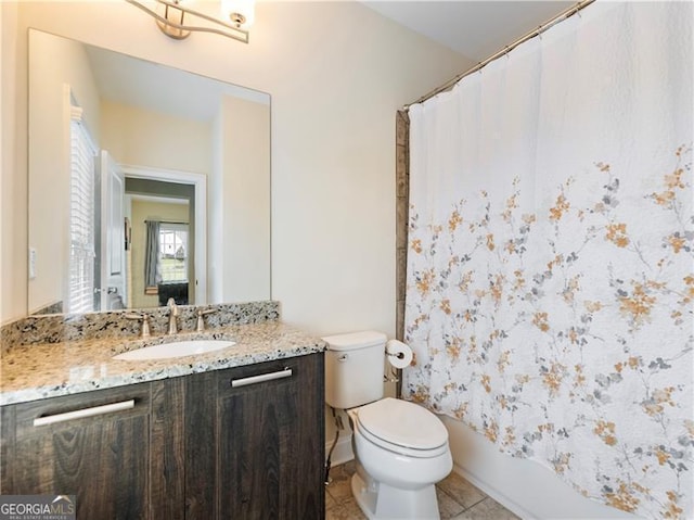 full bath with vanity, curtained shower, tile patterned flooring, and toilet