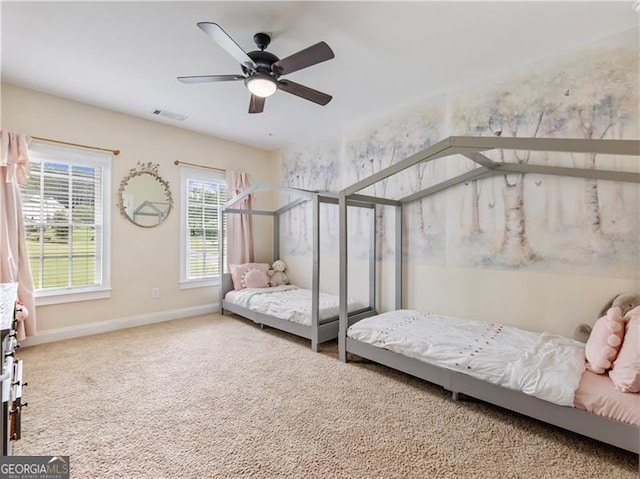 bedroom featuring carpet, visible vents, ceiling fan, and baseboards